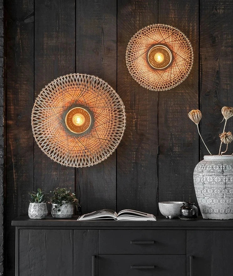 Modern round Wabi-sabi wall lamps in bamboo wood mounted on dark wood wall, perfect for living room or dining area ambiance.