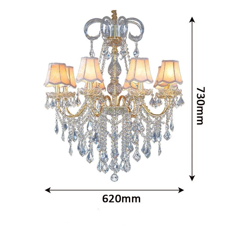 Golden crystal chandelier with lampshades, measuring 730mm high and 620mm wide, ideal for elegant home lighting.