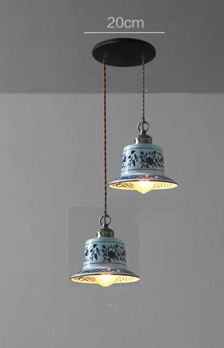 Dual bell-shaped ceramic pendant lights with blue floral design on a 20cm ceiling mount, perfect for kitchen islands.