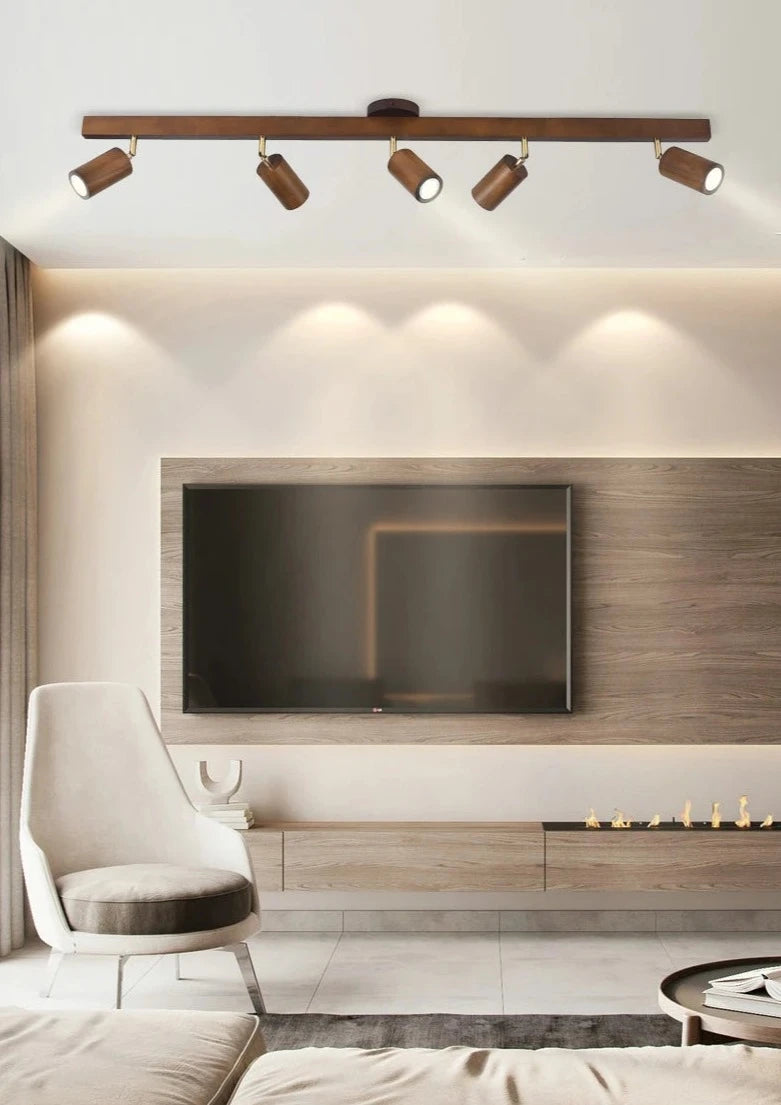 Living room with LUXELY wood grain LED spotlight, providing focused lighting for modern entertainment spaces with Scandinavian flair.