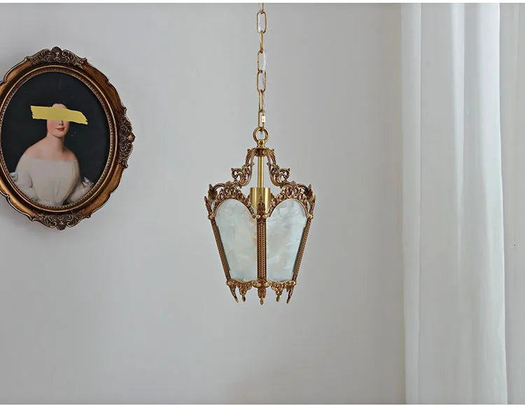 Unlit French retro chandelier with ice flower glass and copper frame. Decorative pendant light for stylish home décor.