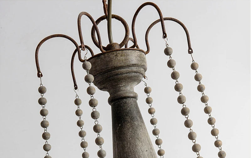 Top detail of Retro Princess Chandelier showing rustic metal hooks and wooden beaded strands for a classic decorative finish.