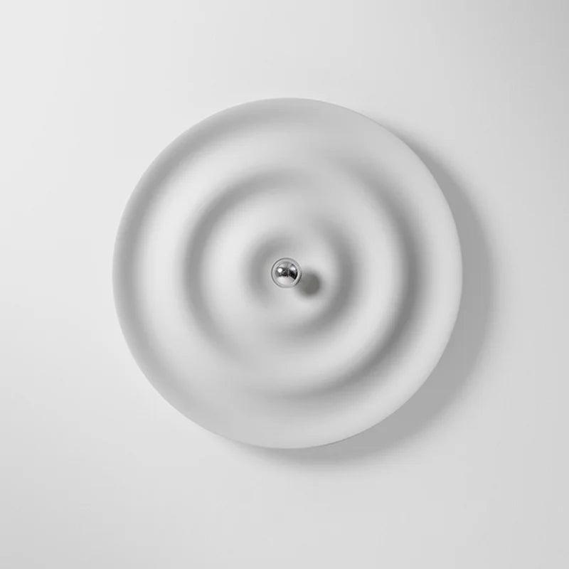 Modern round bedroom sconce