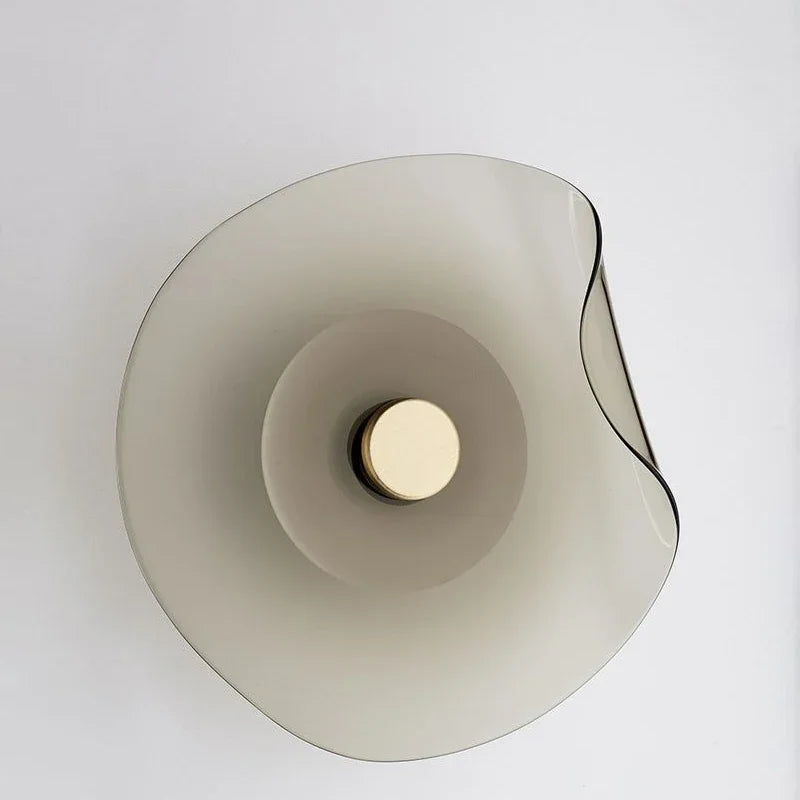 Smoky glass modern wall lamp with round art deco design, ideal for Nordic-style interiors and ambient wall lighting.
