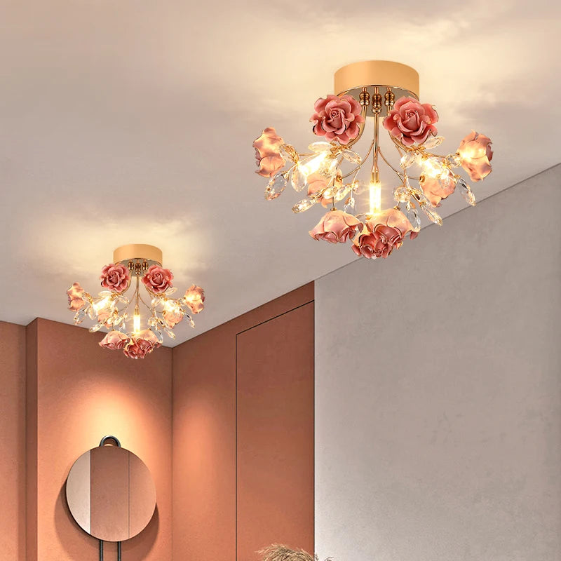Kids rose crystal chandelier with pink ceramic roses and crystal accents, perfect for modern children's bedroom ceiling lighting.