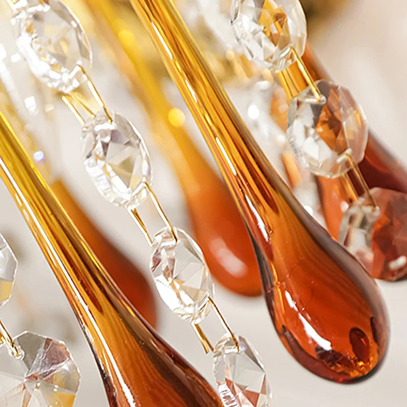 Detailed view of crystal and amber teardrop elements from the Teardrop Crystal Wall Lamp, highlighting luxury lighting design.