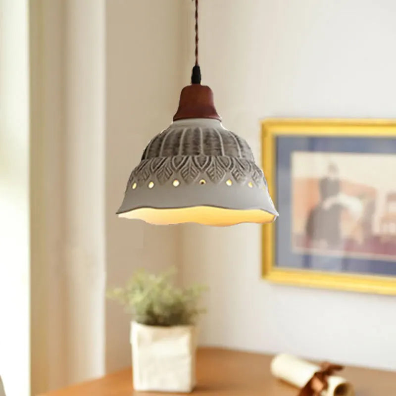 Nordic Ceramic Chandelier - LED Pendant Light Vintage hanging above a wooden desk in a cozy bedroom setting with framed wall art.