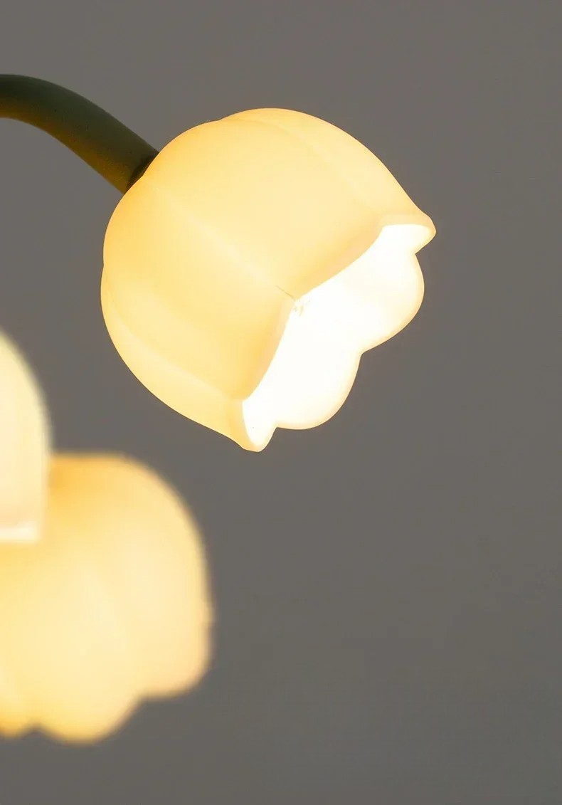 Close-up of glowing tulip-shaped LED bulb from the Nordic Atmosphere Lamp, highlighting warm ambient lighting effect.