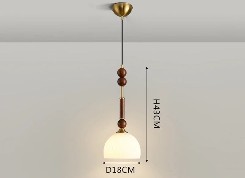 Compact Nordic Pendant Light with glass globe and wood stem, ideal for LED lighting in bedrooms or counters.
