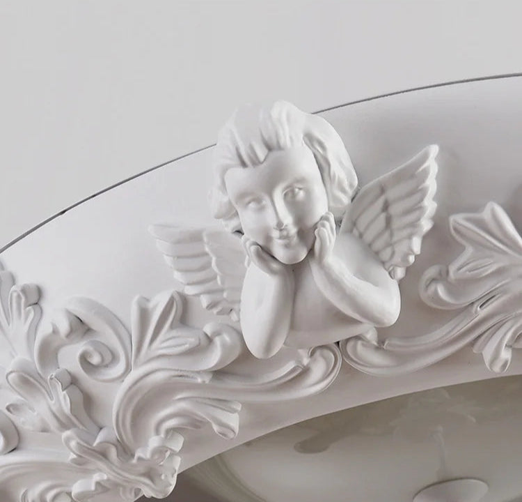 Angel detail on carved plaster chandelier - french farmhouse ceiling light, adding charm and elegance to vintage lighting.