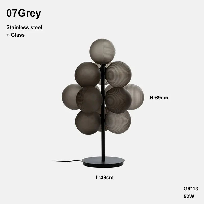 Grey Grape LED table lamp with 13 glass globes, 69cm tall, combining stainless steel and glass for a modern look.