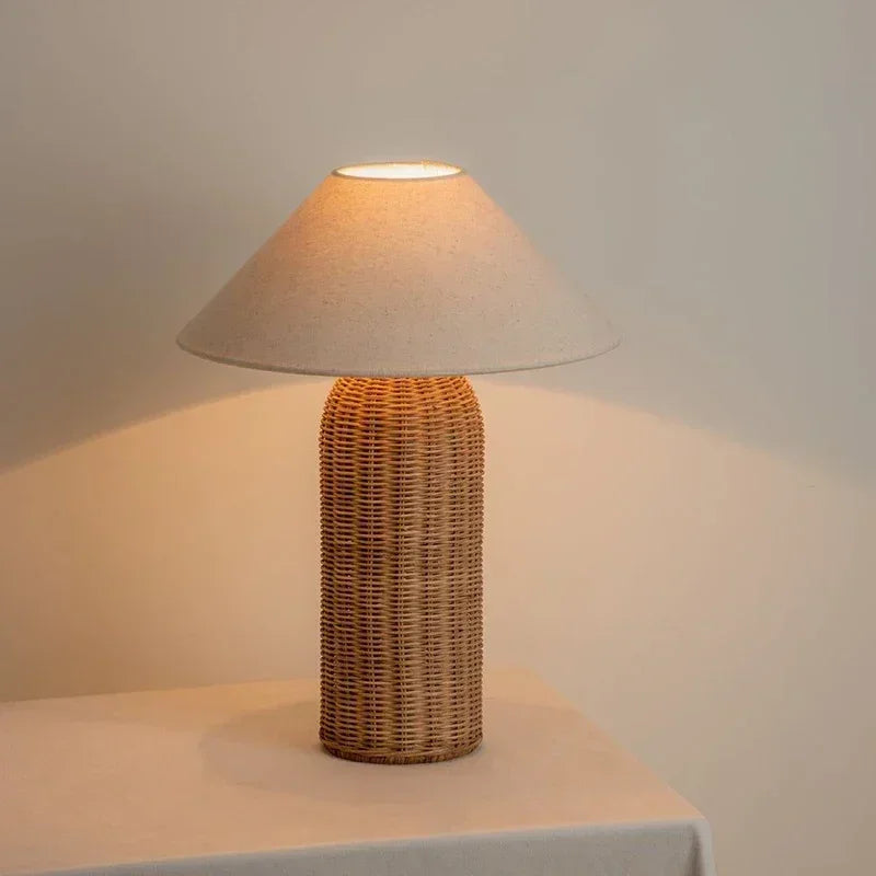Tall Wabi-sabi fabric wood table lamp with cylindrical rattan base and wide conical shade, perfect for cozy bedroom ambiance.