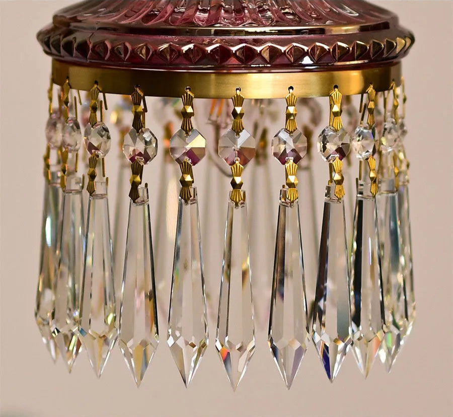 Crystal prism fringe on retro French chandelier with gold accents, luxury pendant light for elegant home lighting.