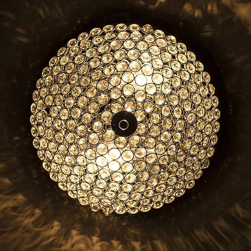 Luxury Crystal LED Chandelier viewed from below, showcasing circular crystal design and warm ambient lighting.