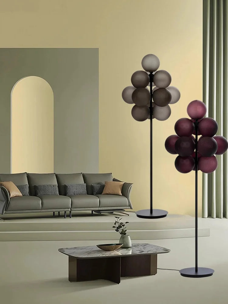 Side-by-side purple and grey Grape LED Chandeliers in a modern room, showcasing color options for stylish lighting.