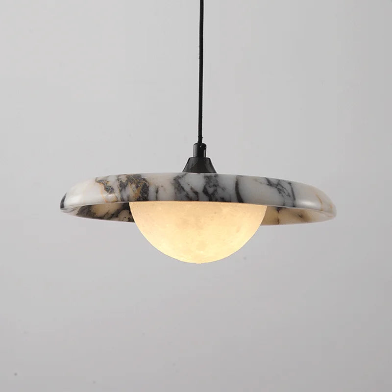 Matte Marble Pendant Lamp with black round design and soft LED glow, ideal for modern bedroom lighting and elegant interior decor.
