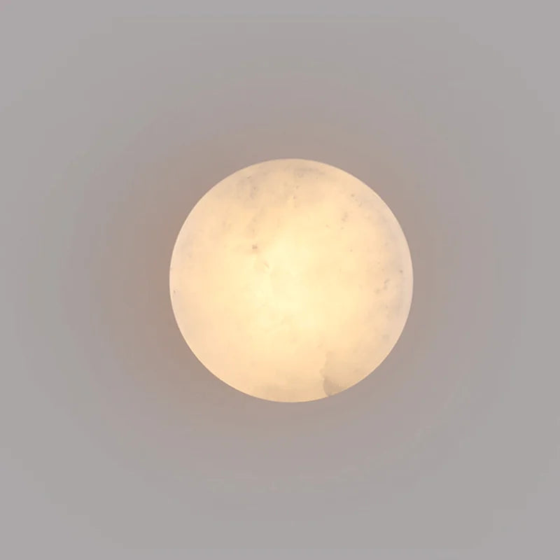 Front view of Modern LED Marble Wall Lamp showcasing its soft, diffused glow and circular marble design for ambient lighting.