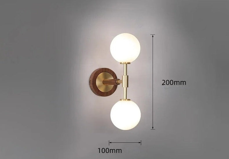 Vertical brass wall sconce with size specifications, ideal for hallways or bathrooms with limited space.