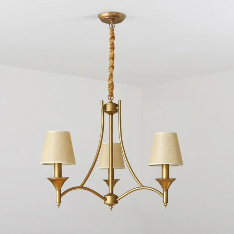 Three-light European retro fabric chandelier with beige shades and gold frame, perfect for vintage bedroom or living room decor.