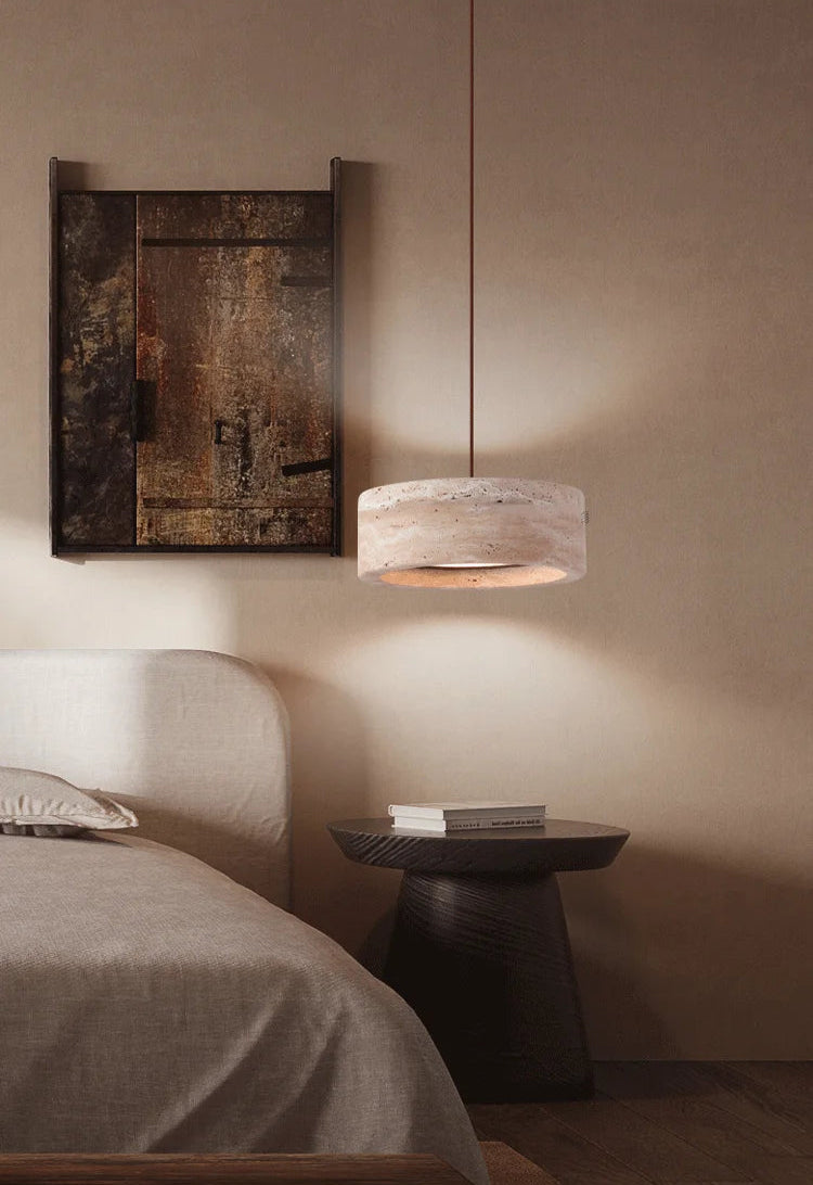 Travertine Retro Pendant Light illuminating a bedside table, blending modern design with natural materials for cozy bedroom lighting.