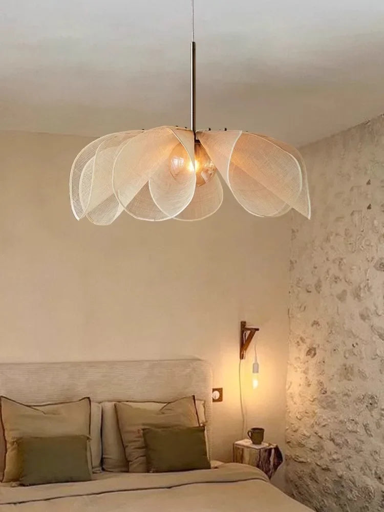 Nordic pendant ceiling light with bubble glass chandelier design, enhancing a serene bedroom with natural textures and warm lighting.