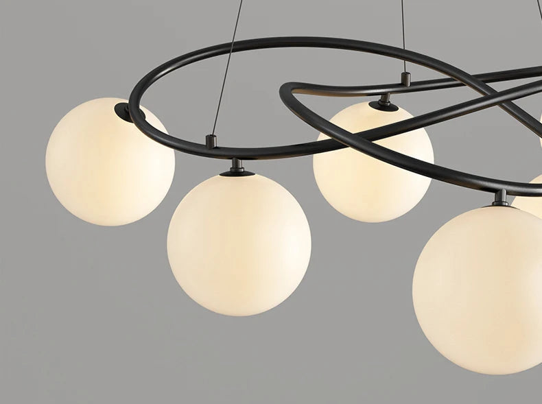 Close-up of black frame LED Chandelier with glowing globe bulbs, highlighting modern craftsmanship and soft lighting effect.