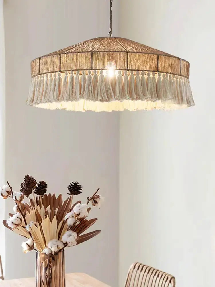 VIGOUS Rattan Pendant Light above a rustic dining setup, combining retro elegance with handcrafted charm for warm lighting.