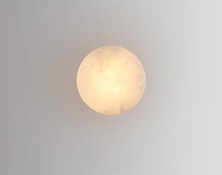 Glowing circular Modern LED Marble Wall Lamp viewed from the front, ideal for soft ambient lighting in any room.