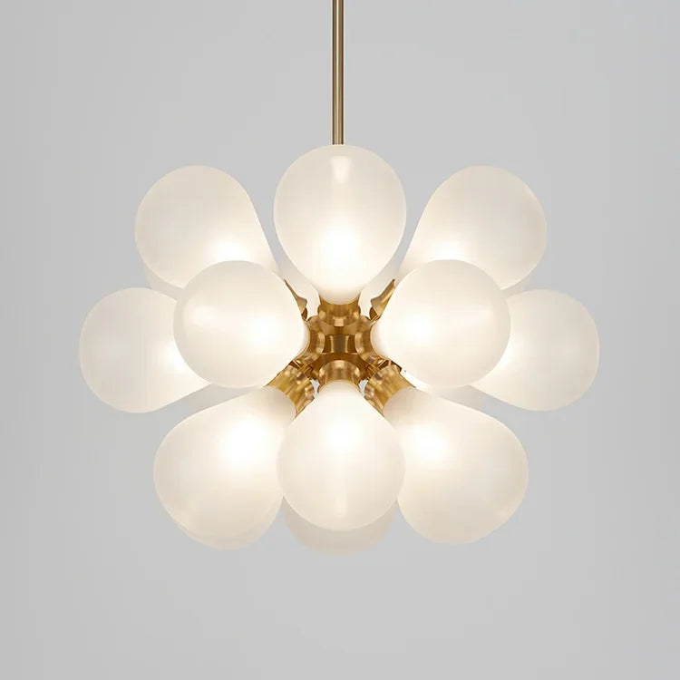 White bubble glass chandelier in Scandinavian style with gold finish, ideal for soft ambient lighting in modern spaces.