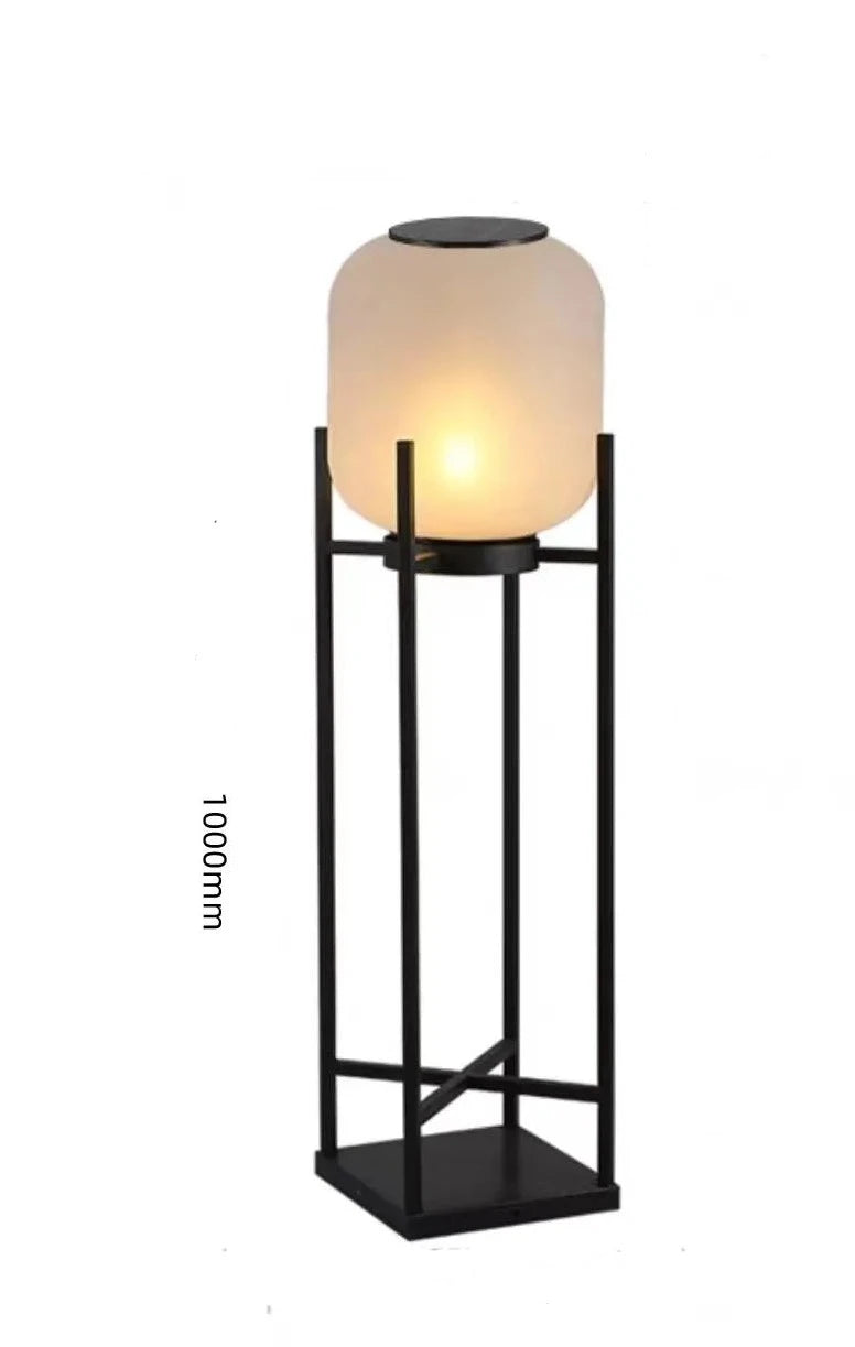Tall 1000mm LUXELY solar garden light with black frame and frosted glass, ideal for villa pathways and patios.