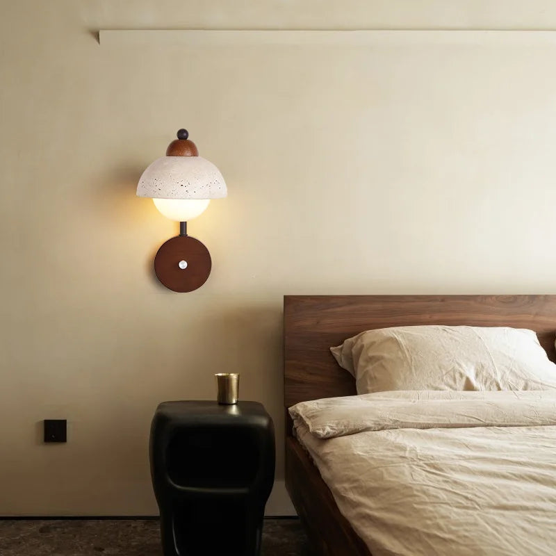 Travertine Stone Wall Lamp installed above a nightstand, enhancing bedroom decor with its Art Deco and minimalist stone design.