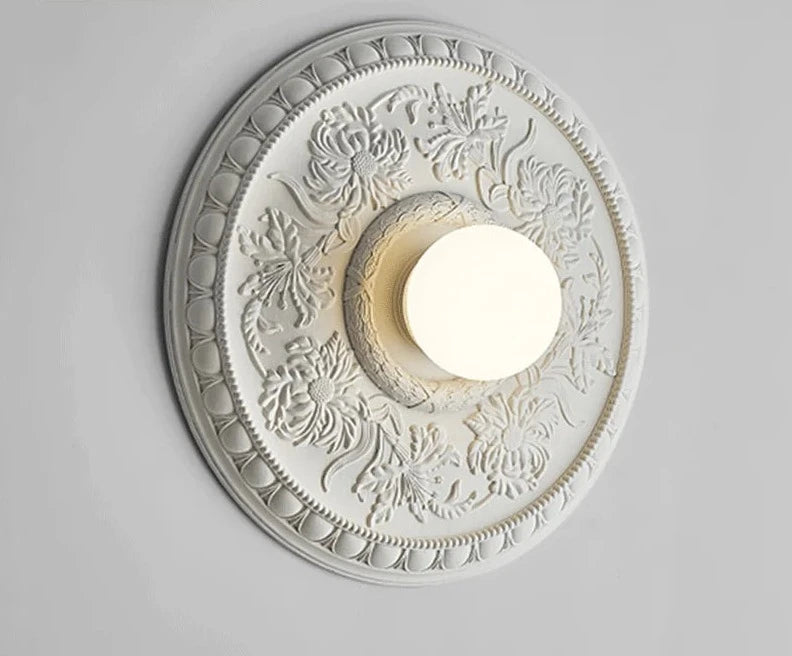 White round wall lamp with imperial floral design, blending classic French style with modern lighting for any room.