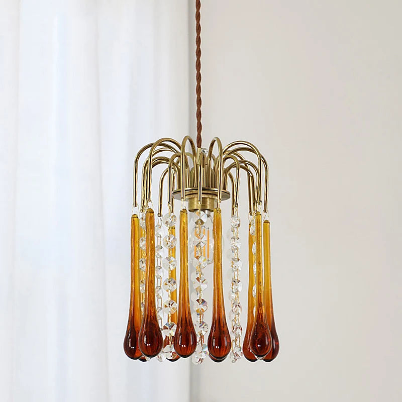 Vintage water drop glass chandelier with copper finish, featuring amber tones and crystal strands for elegant lighting.