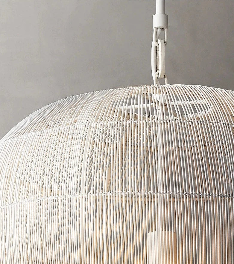 Close-up of white LUXELY rattan pendant lamp showing detailed handwoven craftsmanship and durable frame.