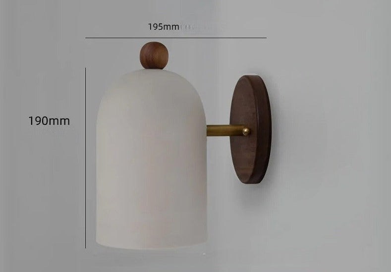 White dome wall sconce with walnut wood base and brass arm, 195mm depth and 190mm height, ideal for Nordic interiors.