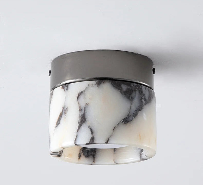 Comparison of Nordic LED wall sconce turned off and on, showing the warm glow through marble glass when illuminated.