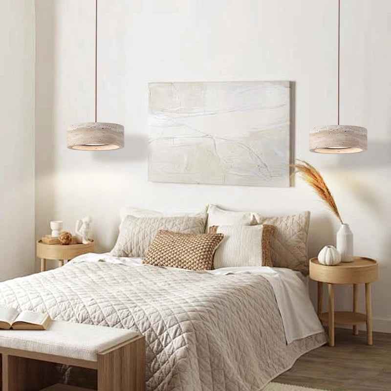 Travertine Stone LED Pendant Light – Modern Fixture used as bedside lighting in a cozy bedroom with neutral tones and wooden furniture.