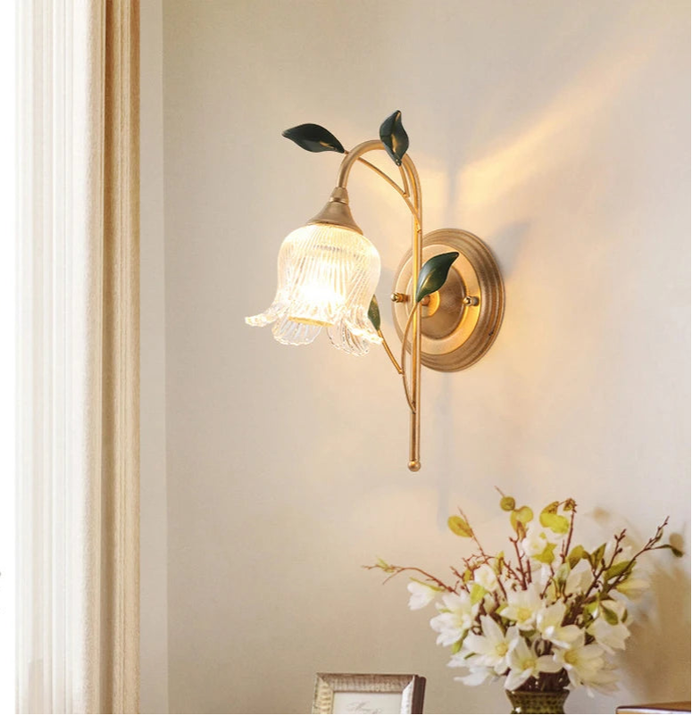 LED French Wall Sconce Light with golden floral design mounted in a living room, adding vintage charm to home decor with soft ambient lighting.