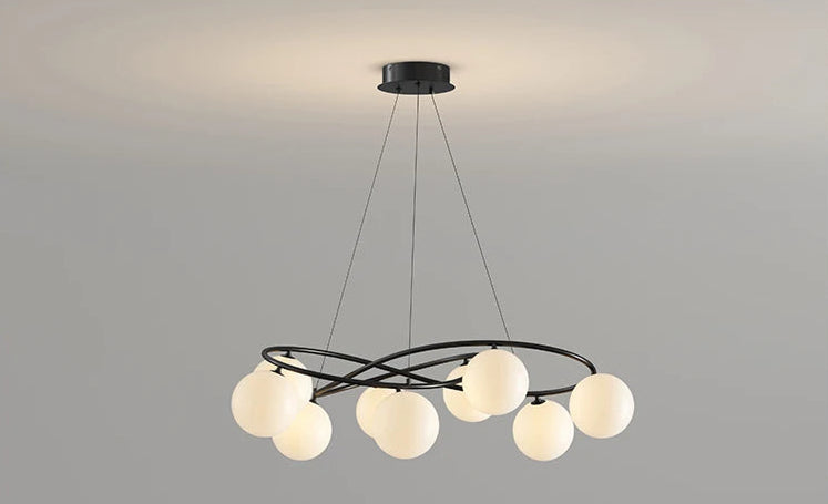 Black frame LED Chandelier with spherical bulbs turned on, designed for modern ceiling lighting in living or dining spaces.