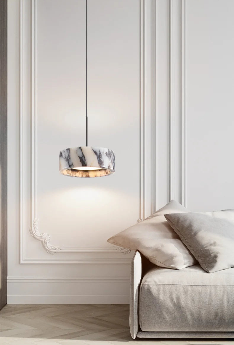 Black Marble Dome Pendant - LED Lamp hanging in a minimalist living room, enhancing the space with soft lighting and marble elegance.