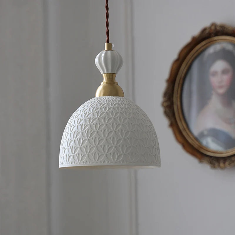 Brass Pendant Light in French Modern style featuring a cream ceramic dome with embossed floral design, perfect for elegant interiors.