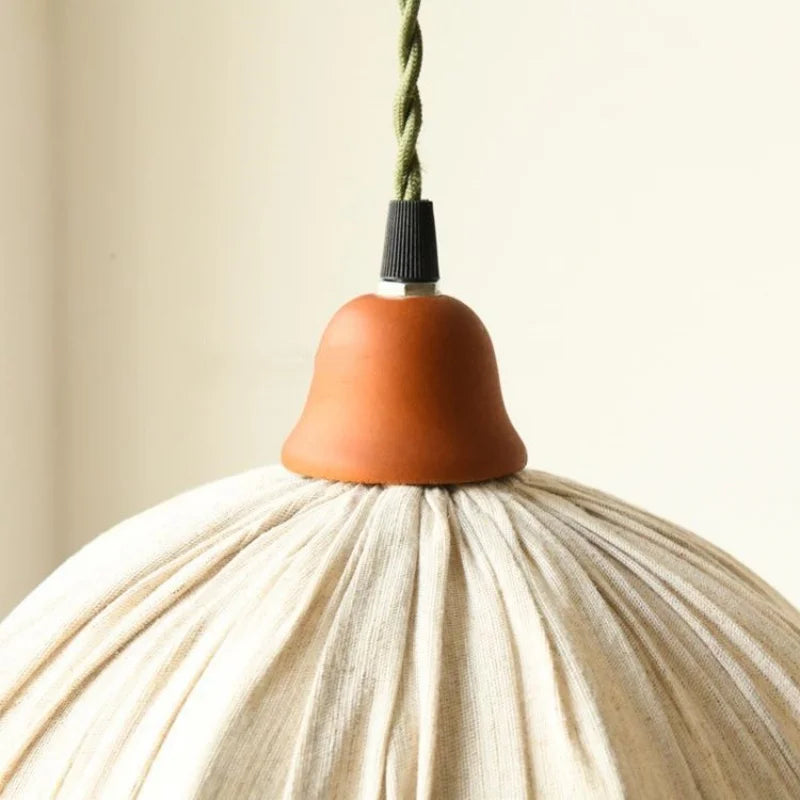 Close-up of Nordic Japanese Pendant Lamp's wooden top and twisted cord, showcasing quality craftsmanship and minimalist design.