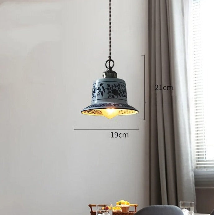 Bell-shaped ceramic LED pendant light with floral design, 19cm wide and 21cm tall, perfect for farmhouse interiors.