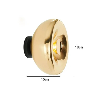 18cm gold lava wall lamp with 15cm depth, featuring a sleek round design and warm LED glow.