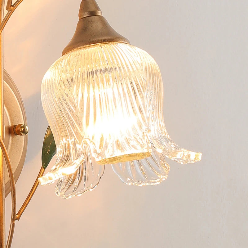 Close-up of French Wall Sconce Light showing ribbed glass flower shade and warm LED glow, perfect for vintage bedroom lighting.