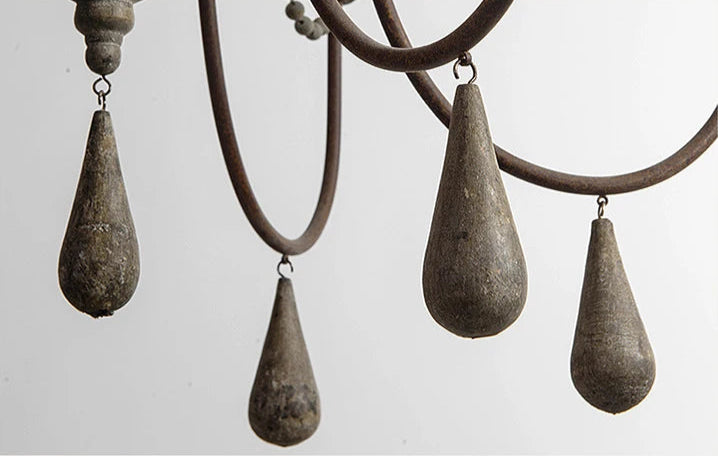 Bottom view of Retro Princess Chandelier's teardrop wooden pendants and curved metal arms, emphasizing its antique design elements.