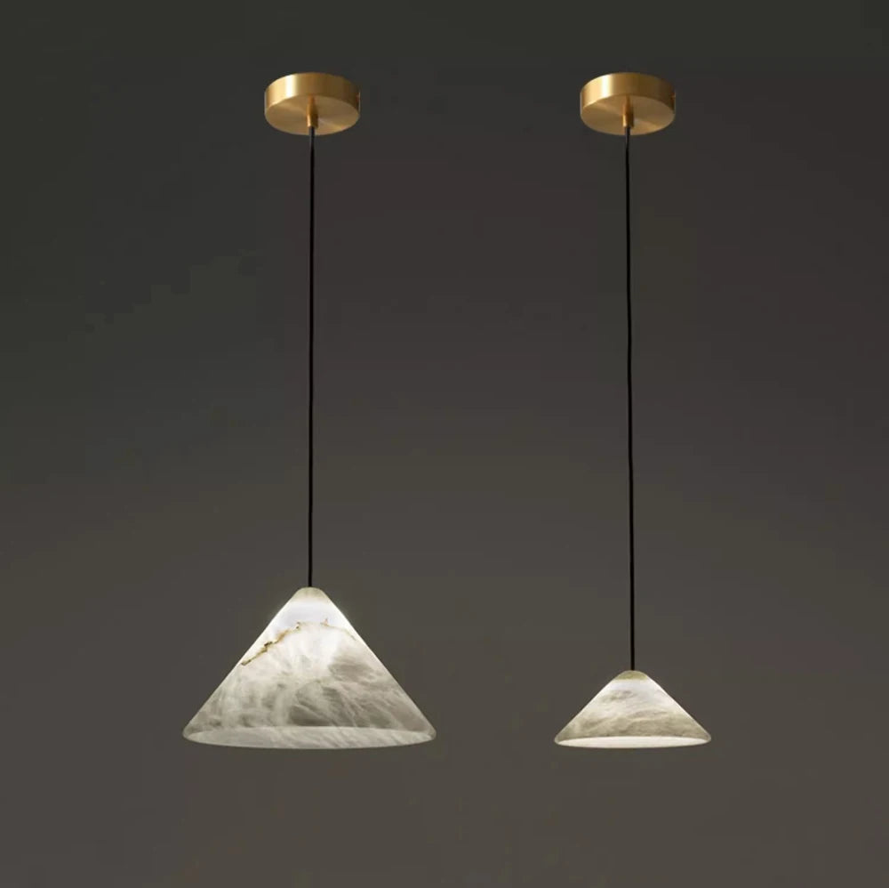 Pair of pyramid-shaped marble LED pendant lights. Marble LED pendant light – modern ceiling lamp dimmable for geometric lighting design.