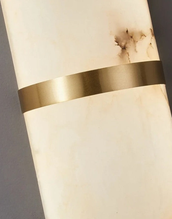 Detail view of gold brass accent on LUXELY marble wall lamp, emphasizing premium finish and elegant design.