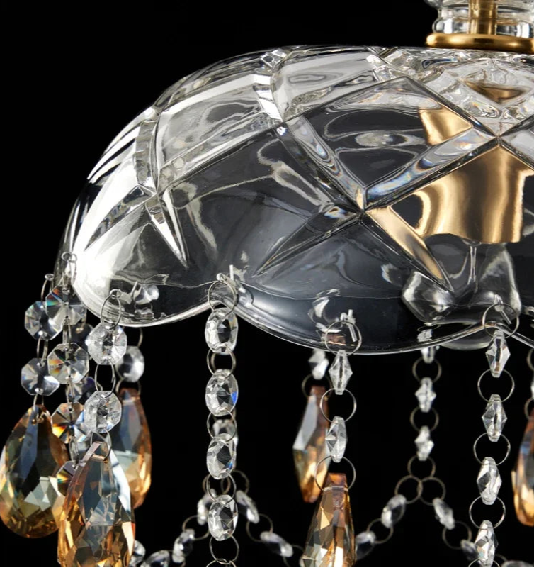 Close-up of LED Crystal Chandelier Art Deco dome with cut-glass detailing and amber crystal chains, highlighting craftsmanship and durability.