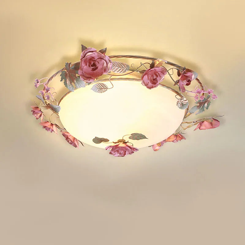 Romantic pink chandelier with French rose design, mounted on ceiling. Ideal for bedrooms, dimmable and energy-efficient lighting fixture.